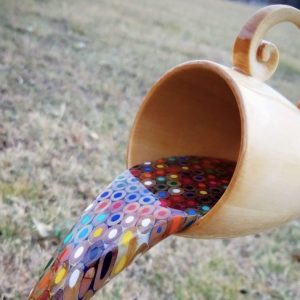 A Floating Coffee Cup Pours a Rainbow of Liquid Pencils0 (0)